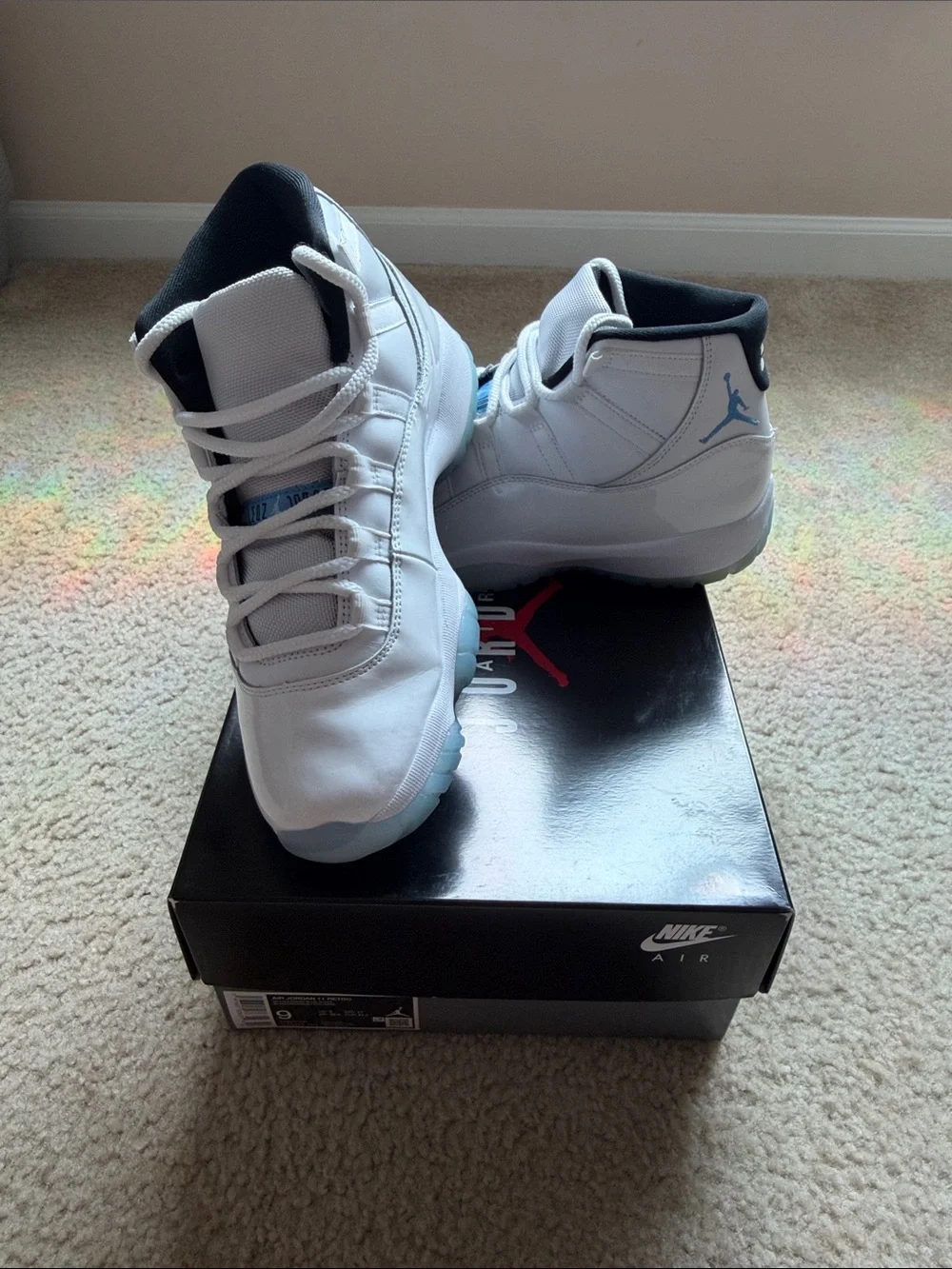 Jordan Air Jordan 11 Retro White and Light Blue Sneakers
